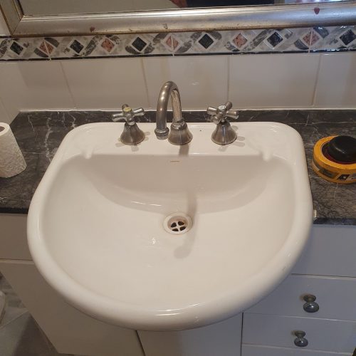 Original bathroom basin before renovation