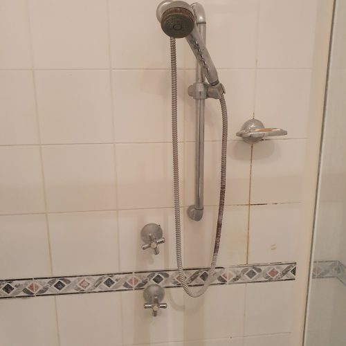 Original shower fittings before bathroom renovation