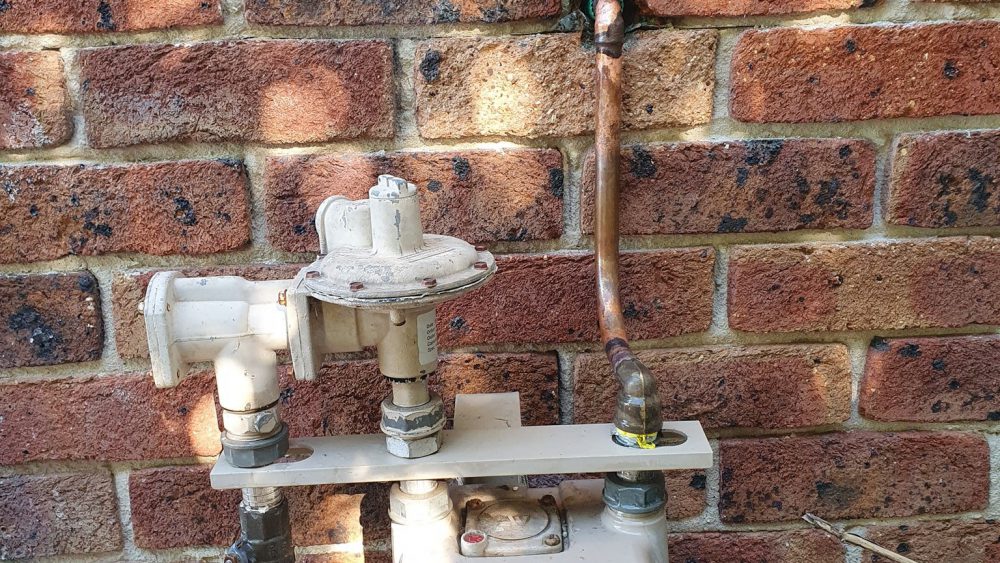 Gas meter and copper pipework inspected during a gas leak repair