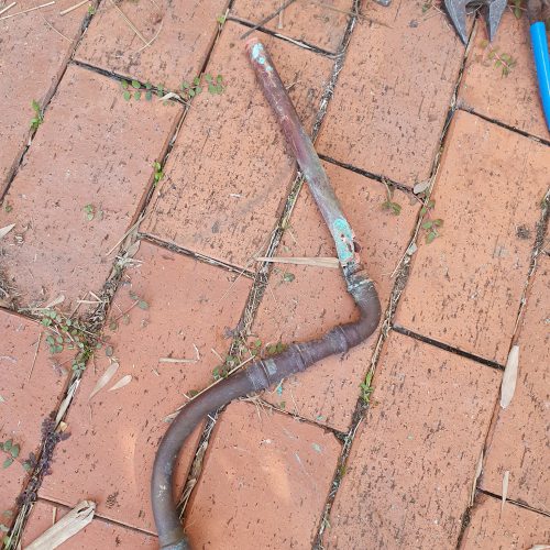 Corroded copper gas pipe removed from a wall