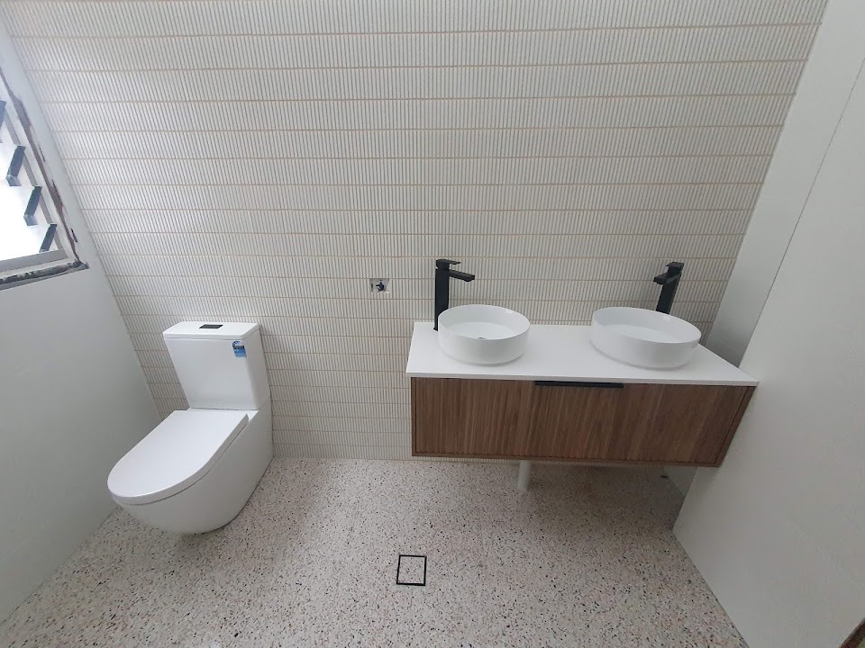Completed bathroom renovation with fitted vanity, toilet and tapware